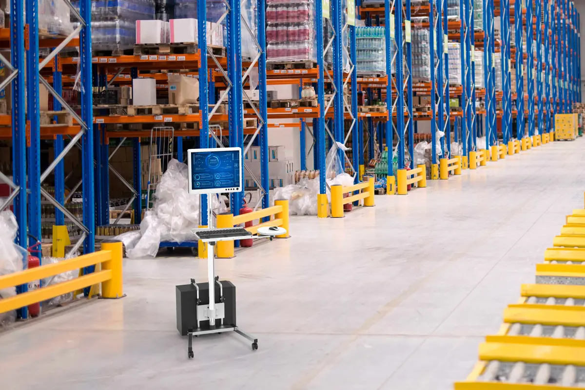 Mobile computer cart in a warehouse aisle